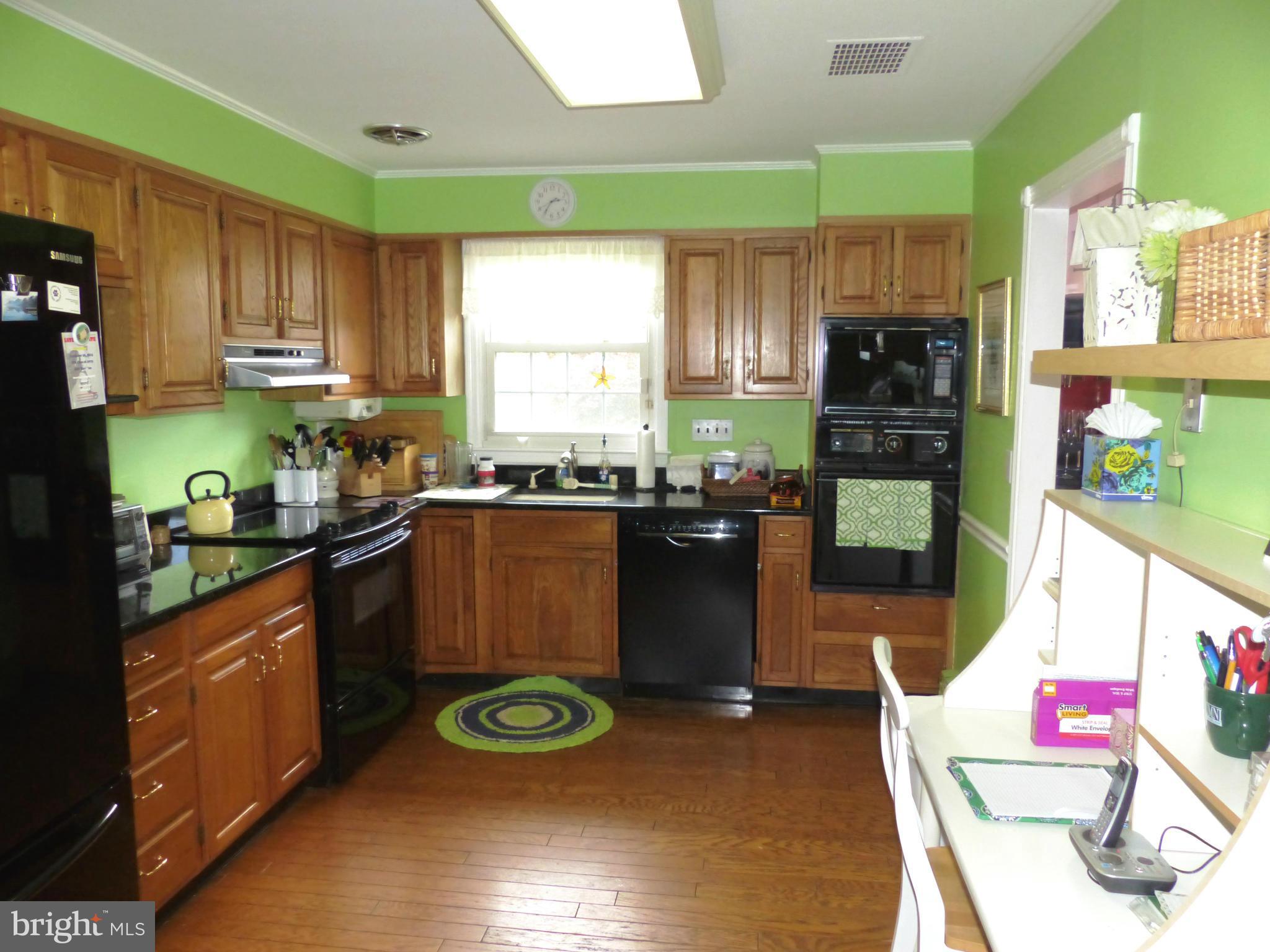 3004 Merrymans Mill Road Phoenix, MD 21131 - Photo 8 of 29 a kitchen with a sink appliances cabinets and a window