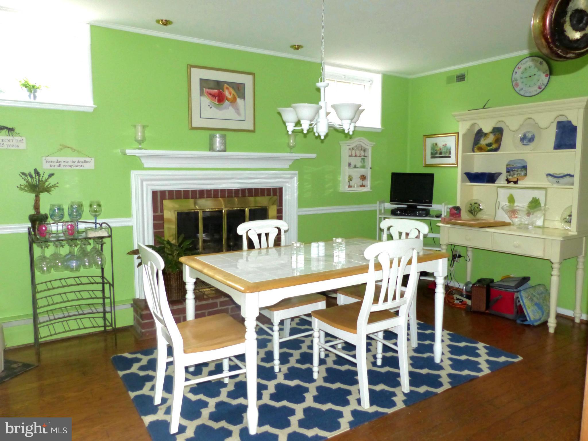 3004 Merrymans Mill Road Phoenix, MD 21131 - Photo 9 of 29 a dining room with furniture fire place and a fireplace