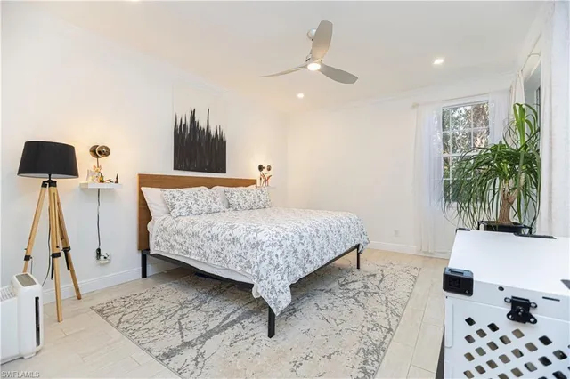 a bedroom with a bed and a couch