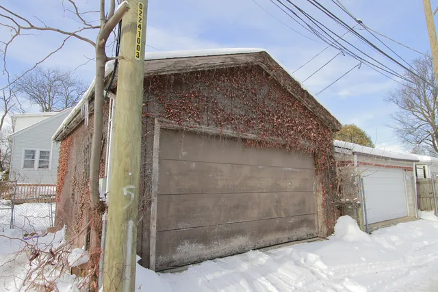 a view of a wooden door of the house