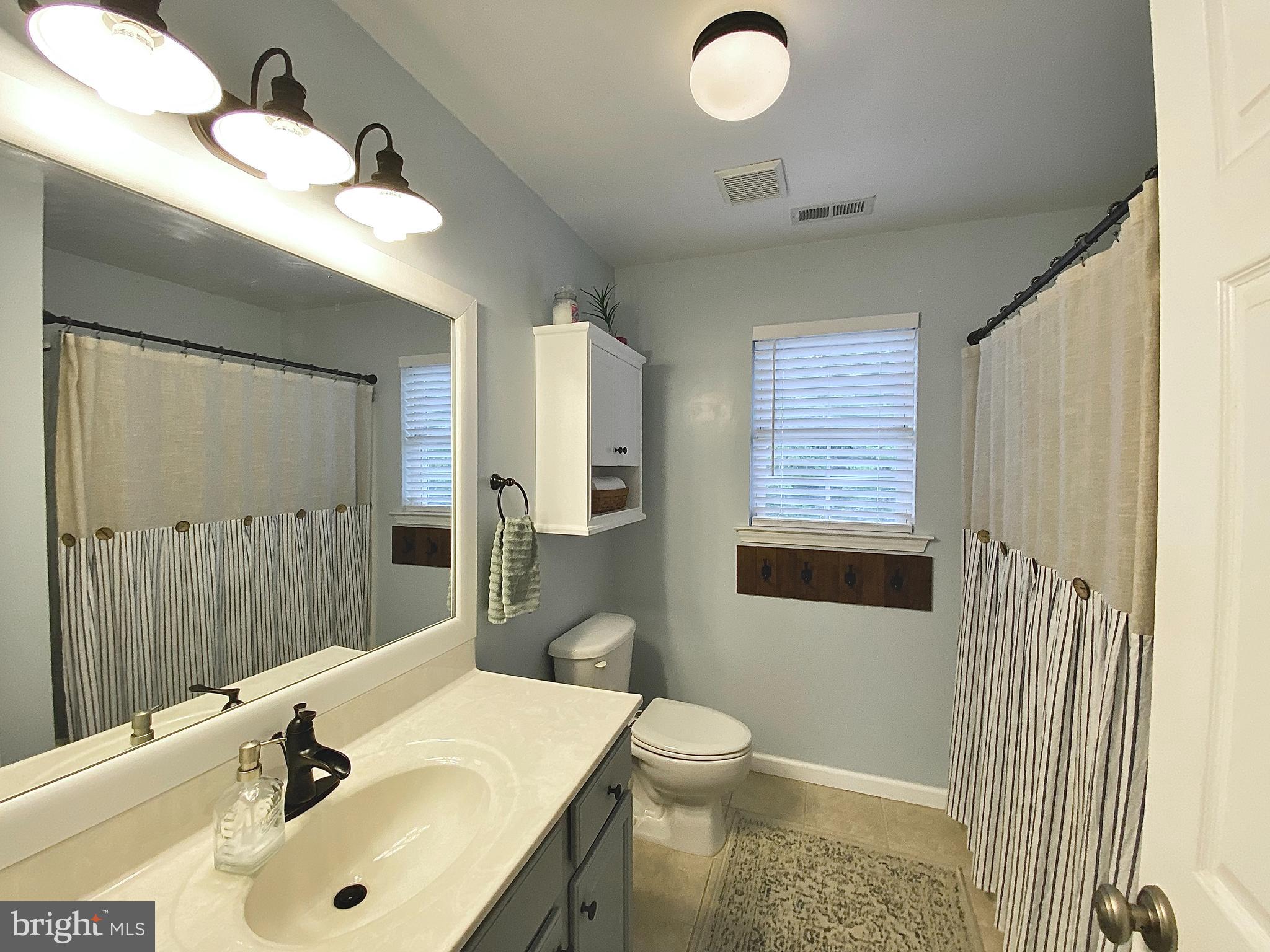 8 Augusta Street Wrightstown, NJ 08562 - Photo 18 of 44 a bathroom with a sink a toilet and shower