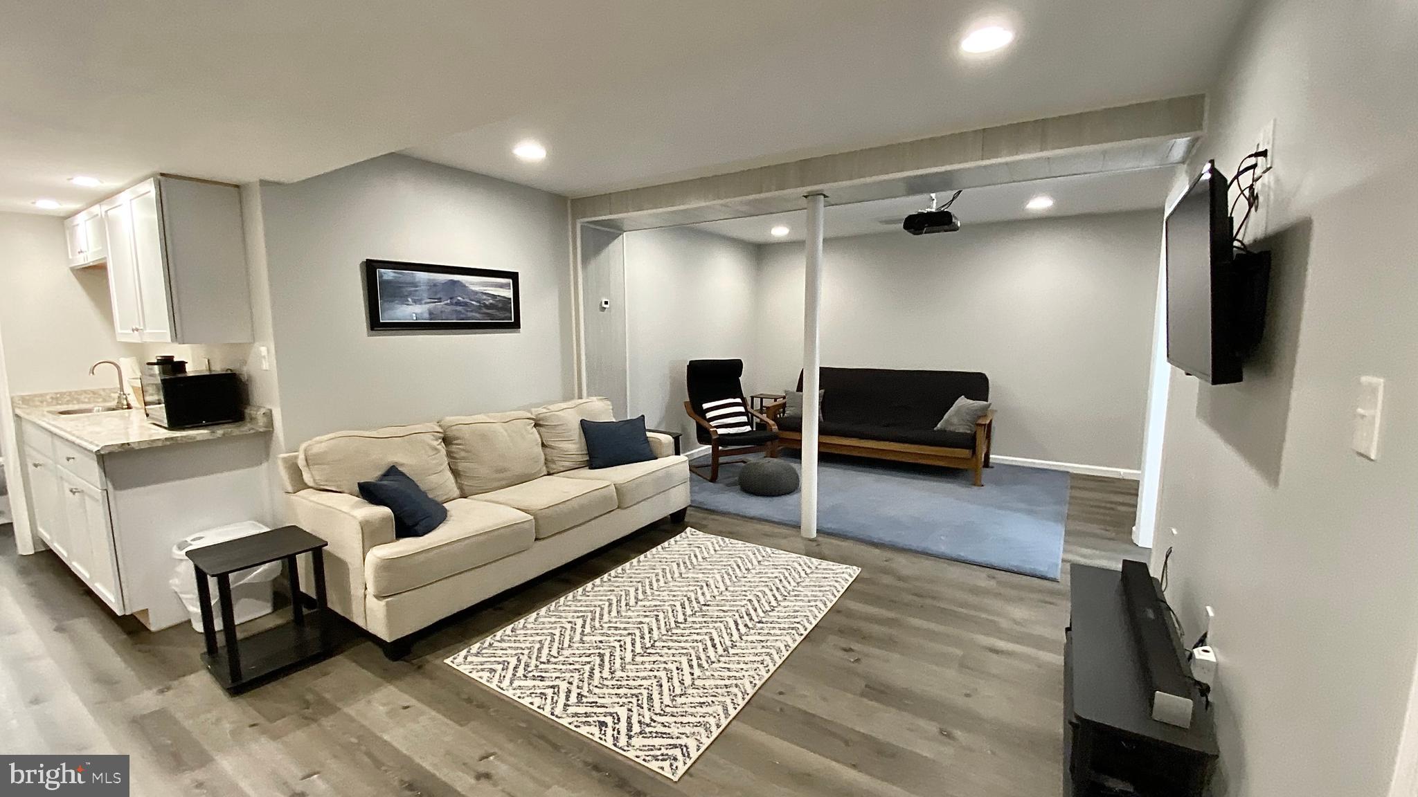 8 Augusta Street Wrightstown, NJ 08562 - Photo 28 of 44 a living room with furniture and a flat screen tv