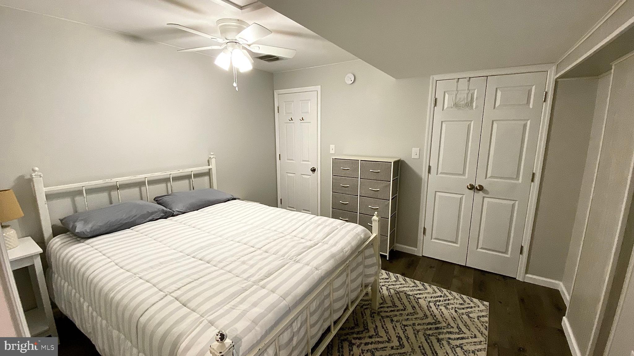 8 Augusta Street Wrightstown, NJ 08562 - Photo 29 of 44 a bedroom with a bed and a chandelier