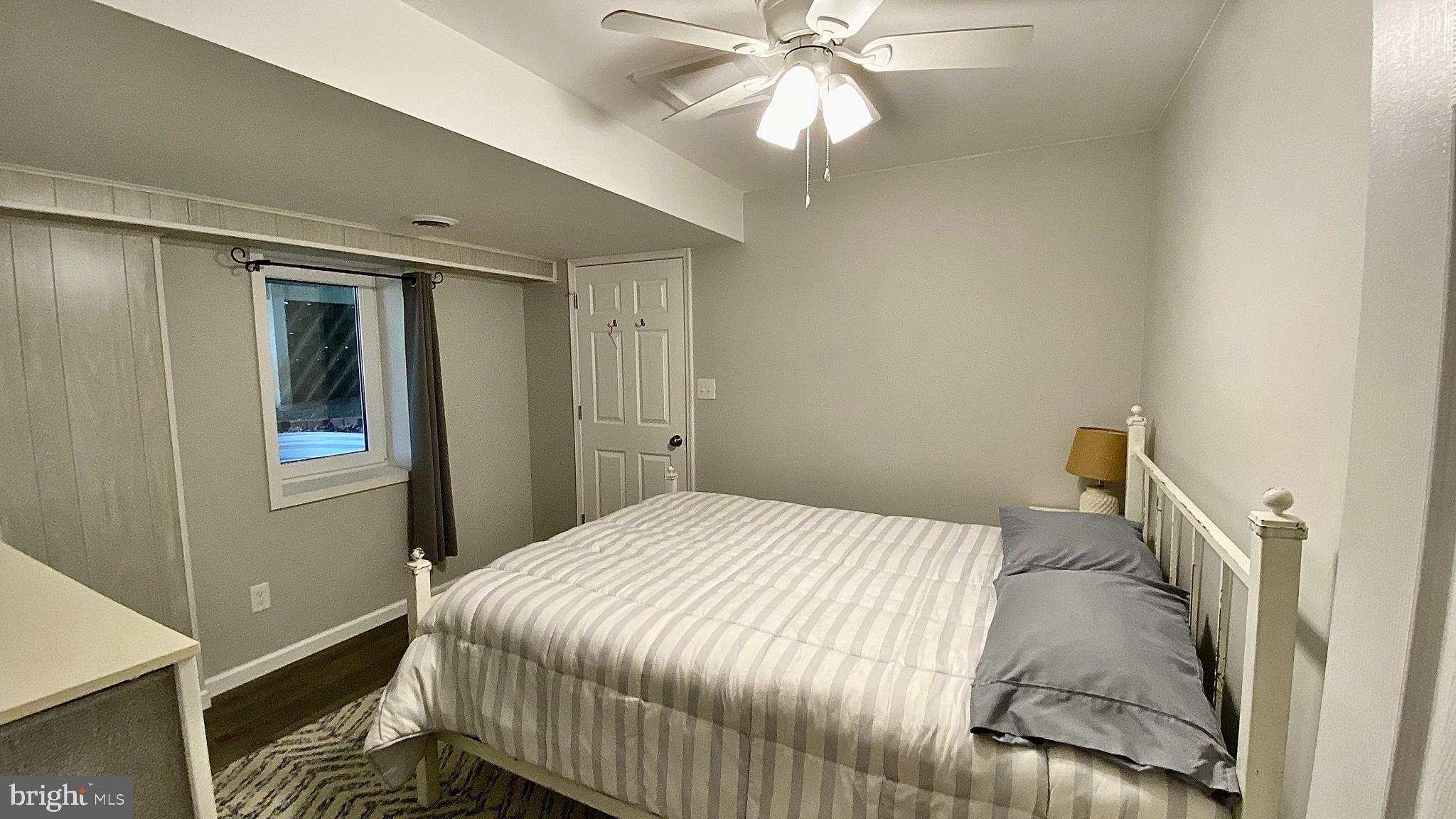 8 Augusta Street Wrightstown, NJ 08562 - Photo 30 of 44 a bedroom with a bed and a chandelier