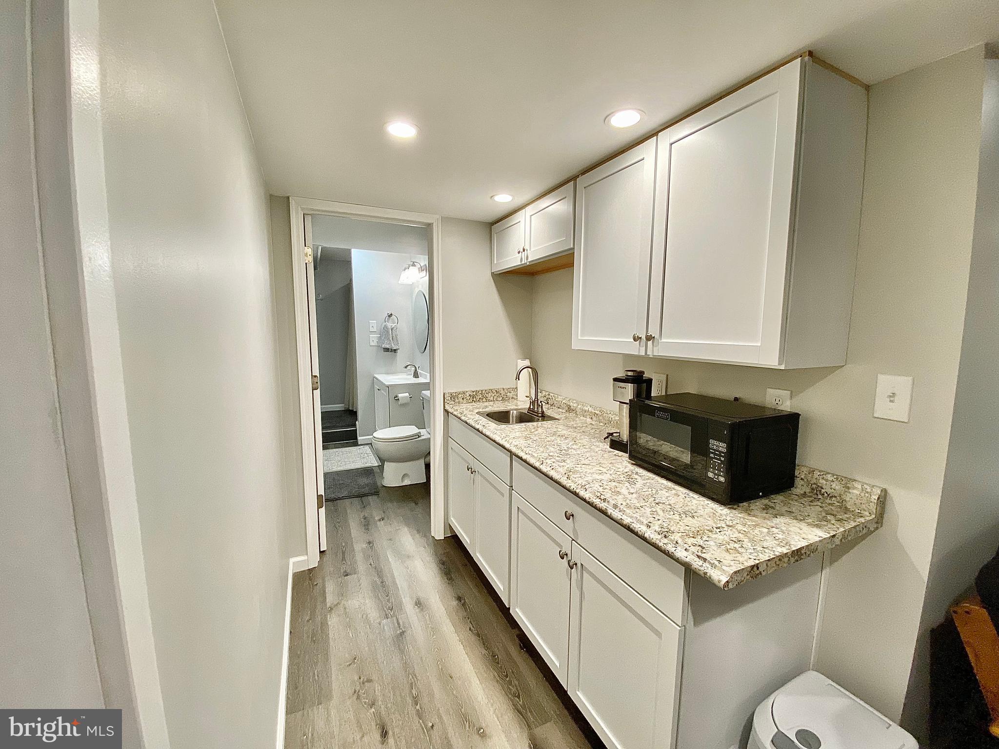 8 Augusta Street Wrightstown, NJ 08562 - Photo 32 of 44 a kitchen with a sink and a refrigerator