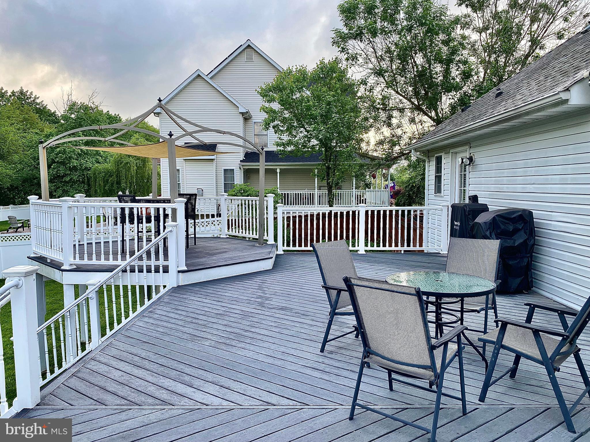 8 Augusta Street Wrightstown, NJ 08562 - Photo 35 of 44 a view of a chair and table on the wooden deck