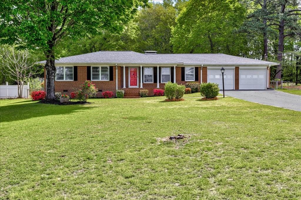241 Burke Circle McDonough, GA 30253 - Photo 1 of 47 a front view of a house with a yard