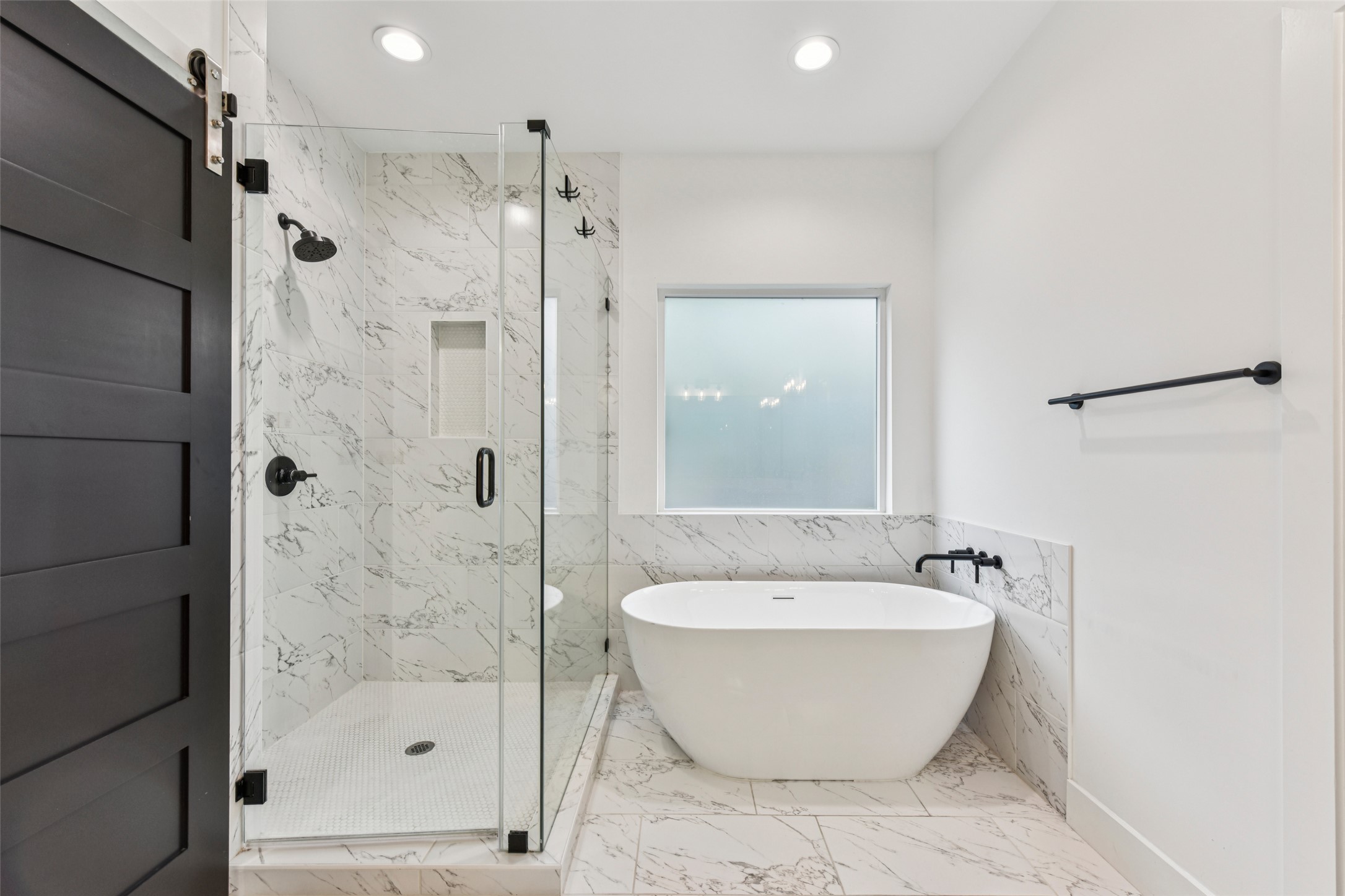 3607 Grant Street, Unit A Austin, TX 78721 - Photo 16 of 40 a white bath tub sitting next to a bathroom