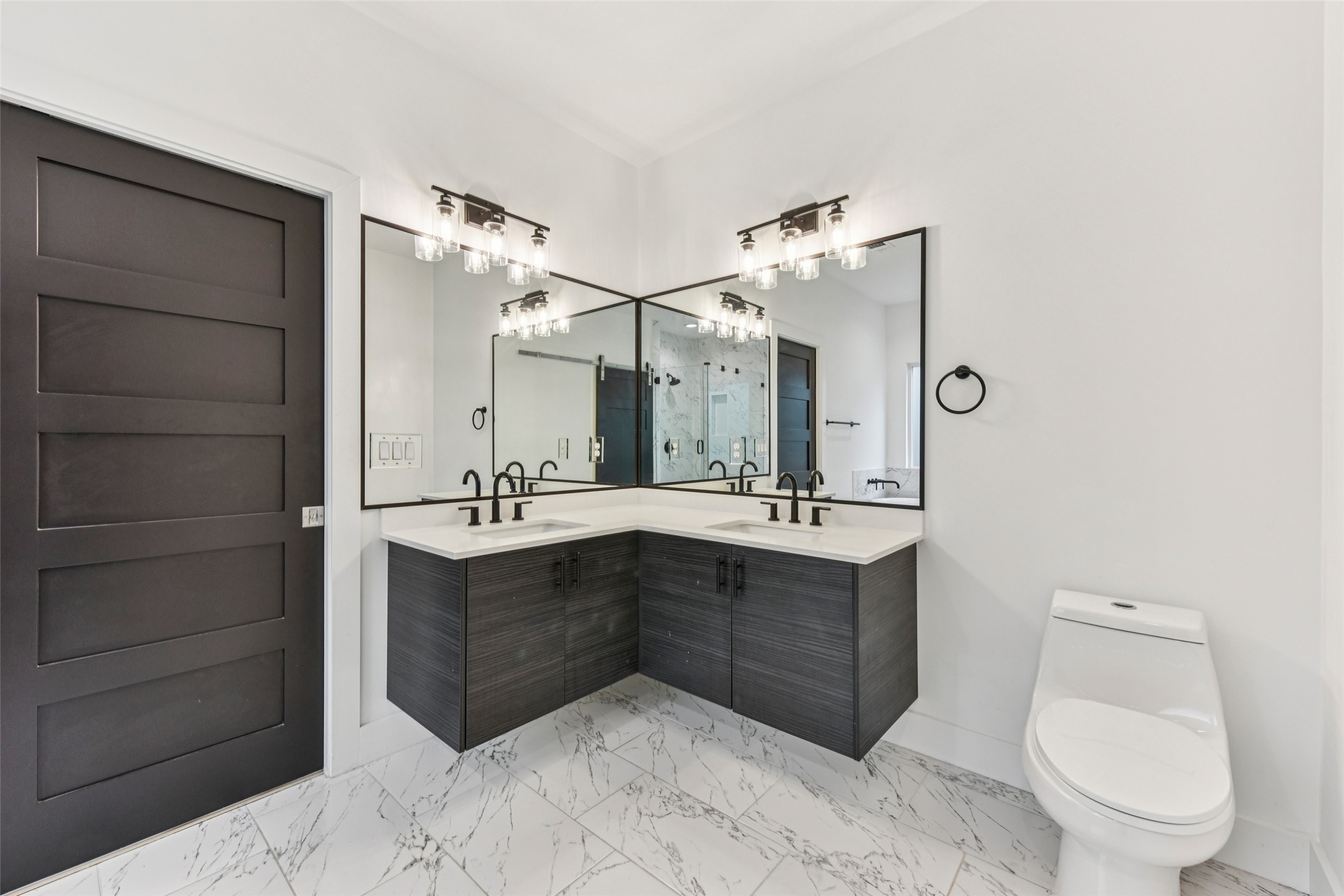 3607 Grant Street, Unit A Austin, TX 78721 - Photo 17 of 40 a bathroom with a sink vanity mirror and toilet