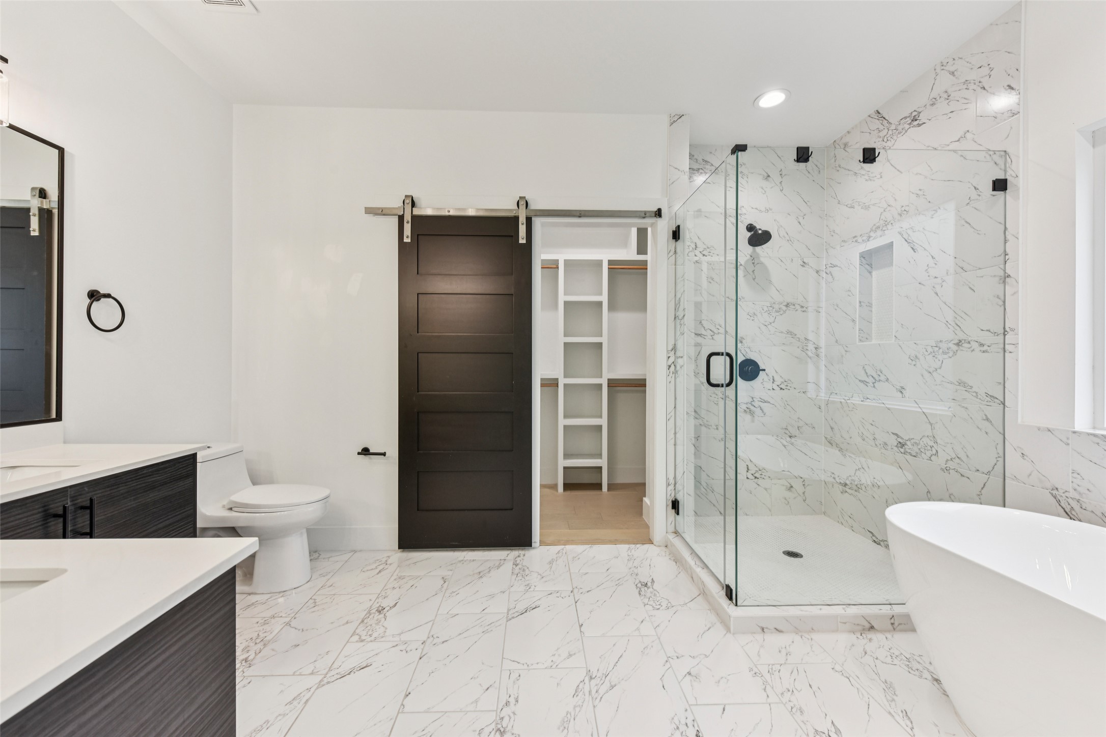 3607 Grant Street, Unit A Austin, TX 78721 - Photo 18 of 40 a bathroom with a toilet a sink and shower