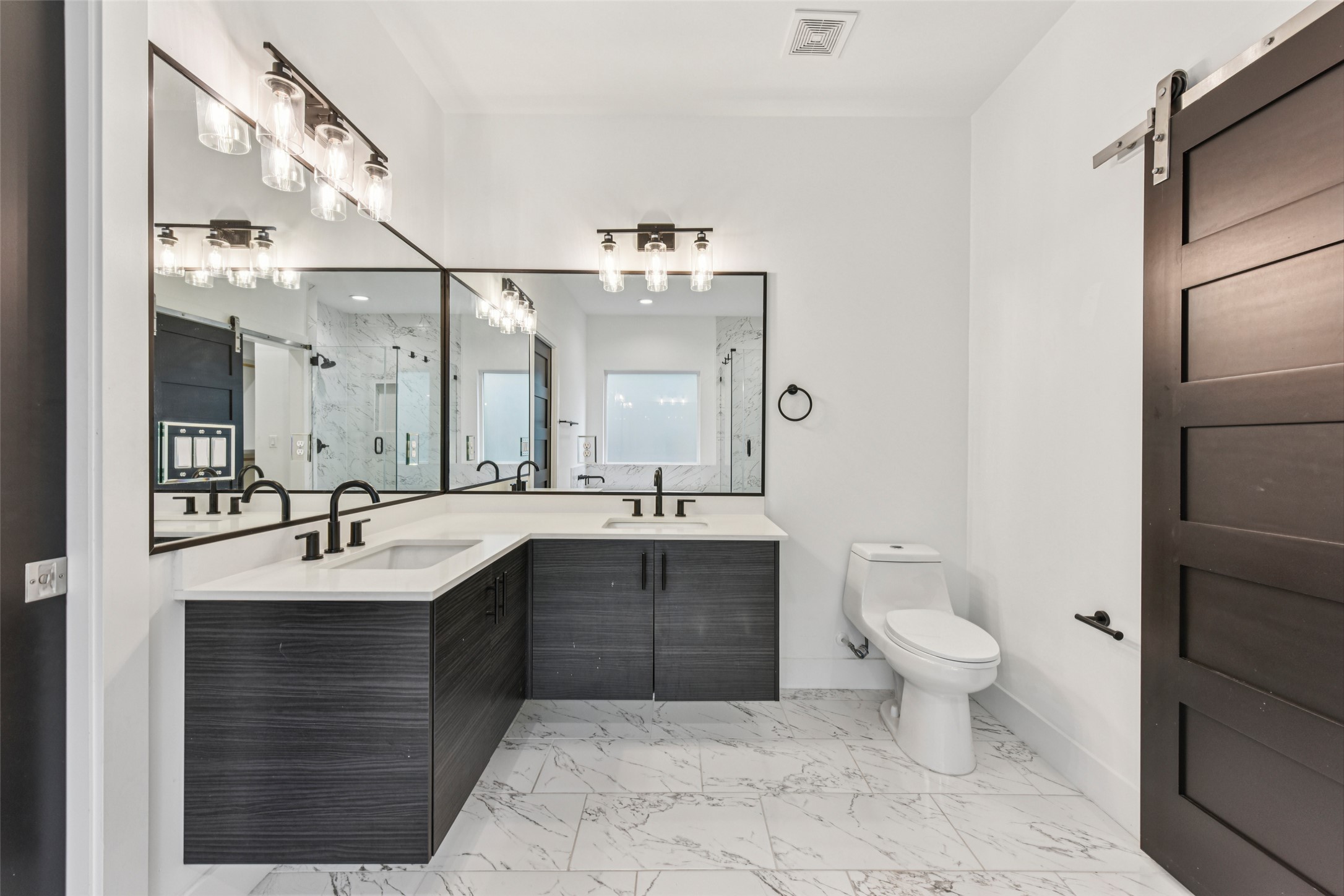 3607 Grant Street, Unit A Austin, TX 78721 - Photo 19 of 40 a bathroom with a sink toilet and shower