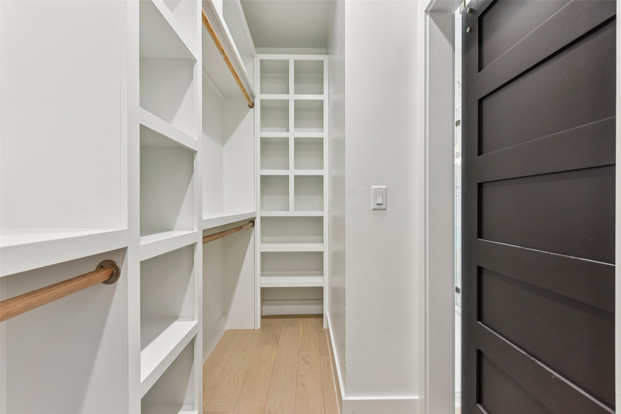 3607 Grant Street, Unit A Austin, TX 78721 - Photo 22 of 40 a view of walk in closet with empty racks
