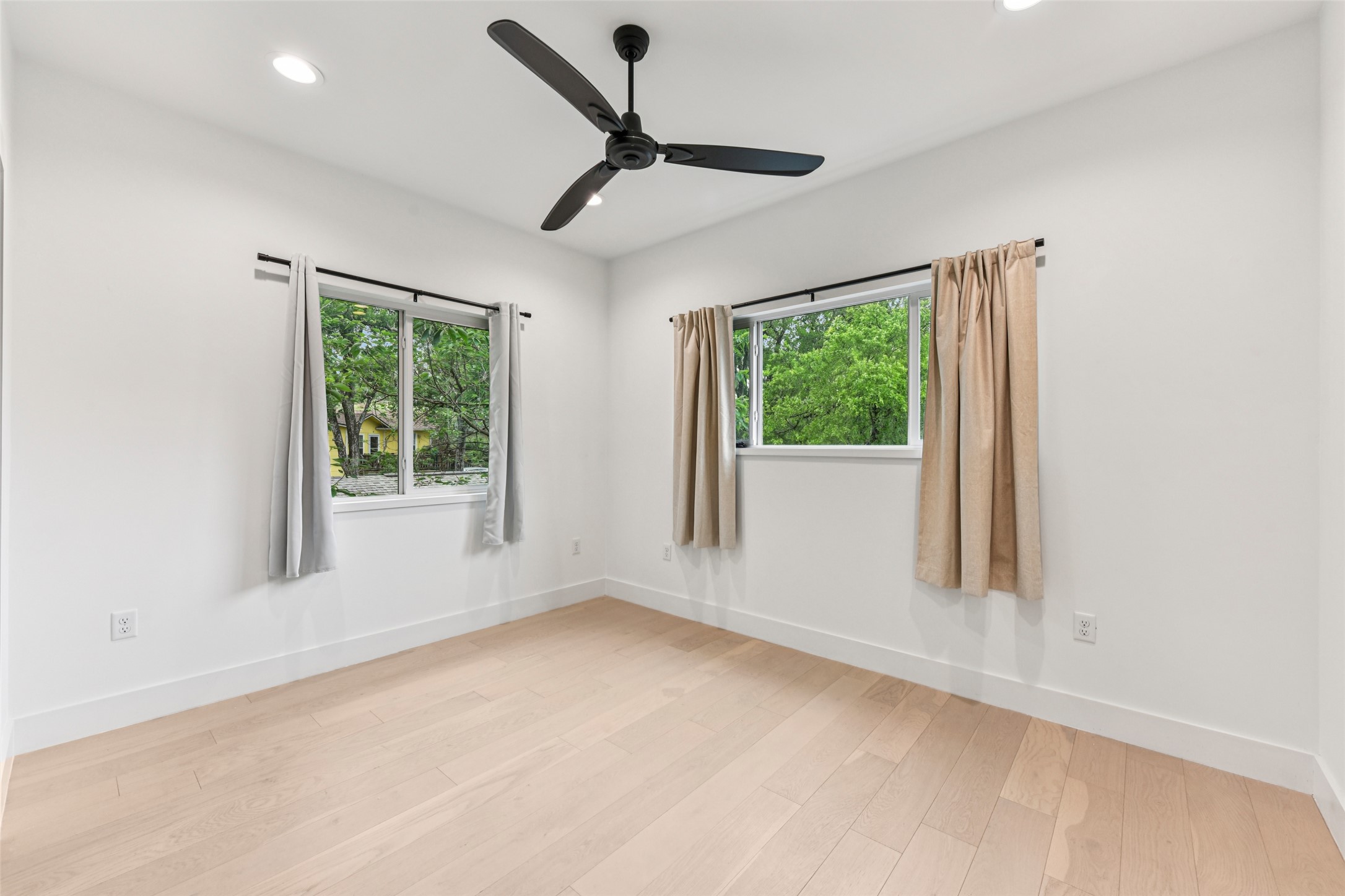 3607 Grant Street, Unit A Austin, TX 78721 - Photo 23 of 40 a view of a livingroom with a ceiling fan and window