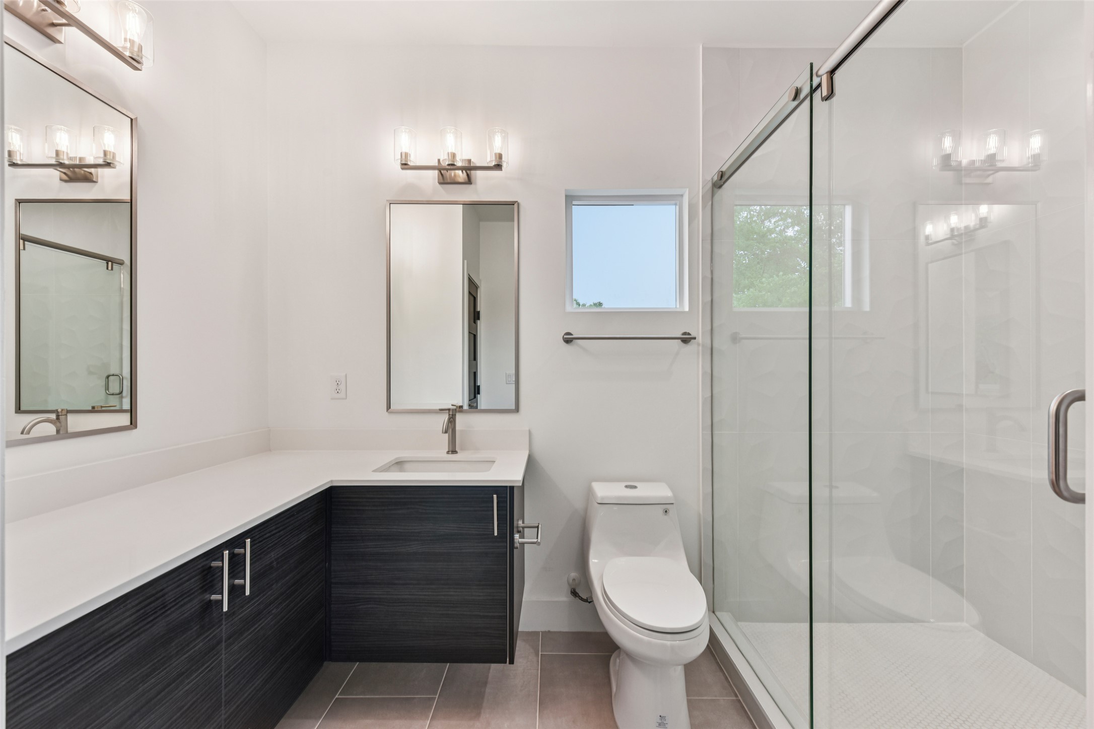 3607 Grant Street, Unit A Austin, TX 78721 - Photo 26 of 40 a bathroom with a toilet sink and mirror