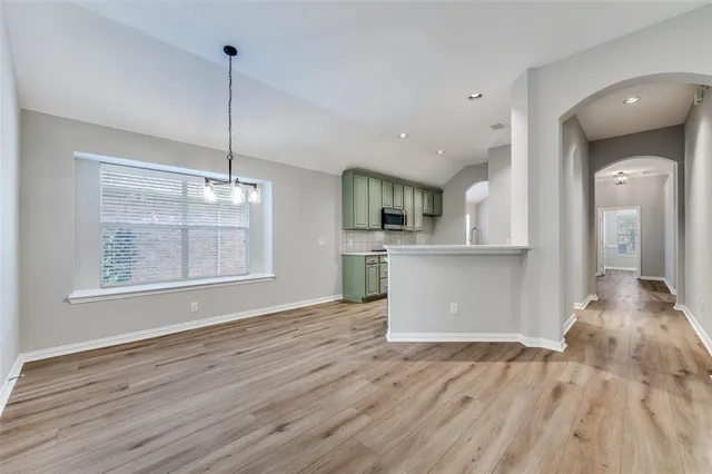 an aerial view of a house with a lake view