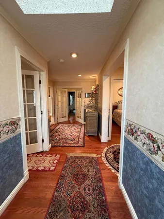 a view of a hallway with living room