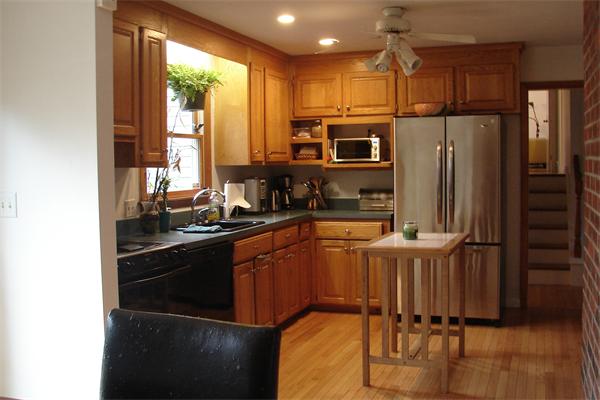 31 Ballardvale Road Andover, MA 01810 - Photo 3 of 14 a kitchen with stainless steel appliances granite countertop a refrigerator a stove a sink and a microwave