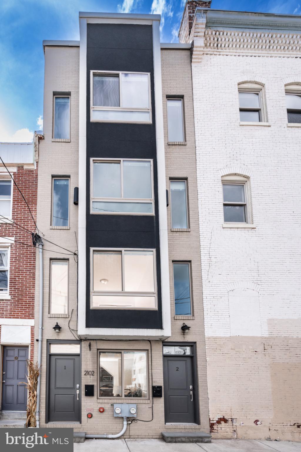 2102 Berges Street, Unit B Philadelphia, PA 19125 - Photo 1 of 29 a front view of a building with a glass door