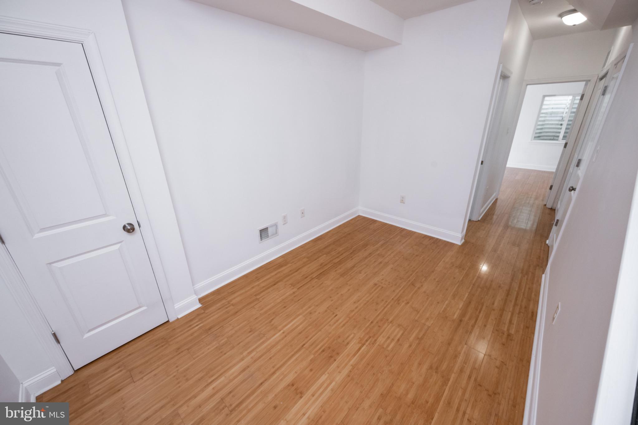 2102 Berges Street, Unit B Philadelphia, PA 19125 - Photo 13 of 29 a view of a room with wooden floor and staircase