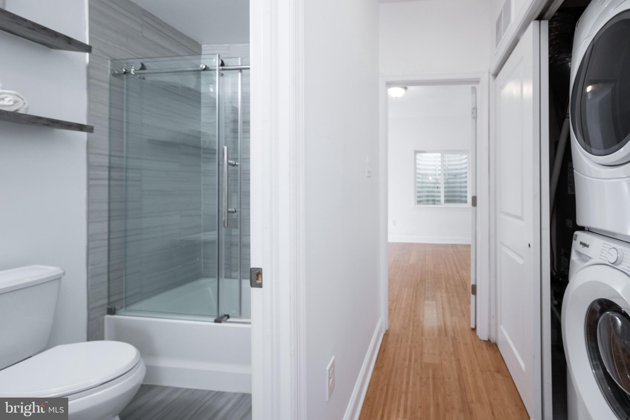2102 Berges Street, Unit B Philadelphia, PA 19125 - Photo 14 of 29 a bathroom with a toilet and a shower