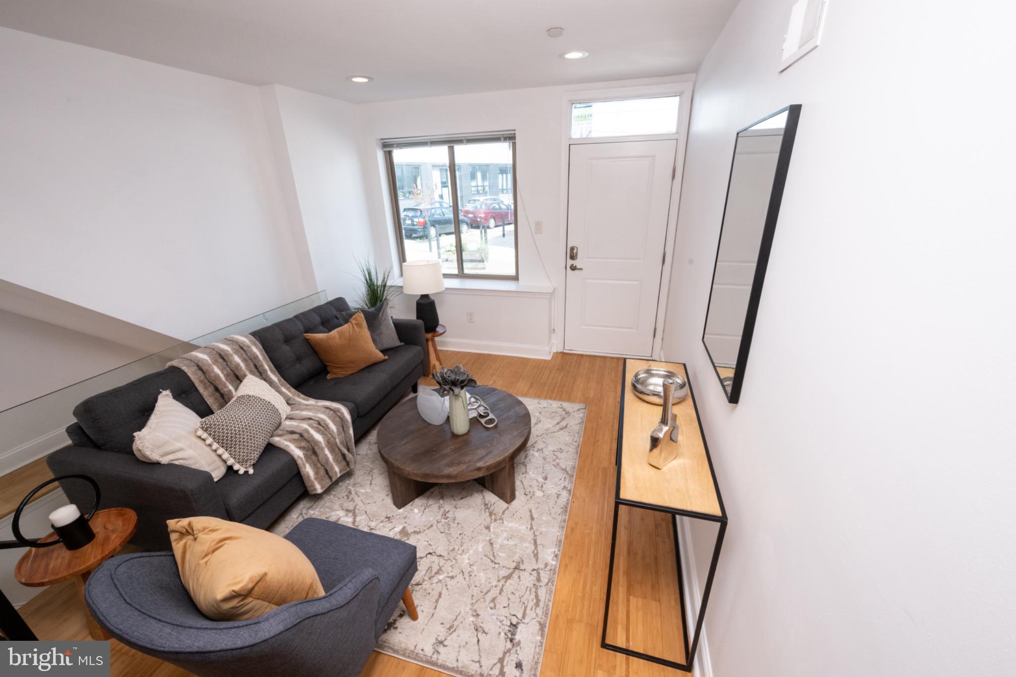 2102 Berges Street, Unit B Philadelphia, PA 19125 - Photo 2 of 29 a living room with furniture and a rug