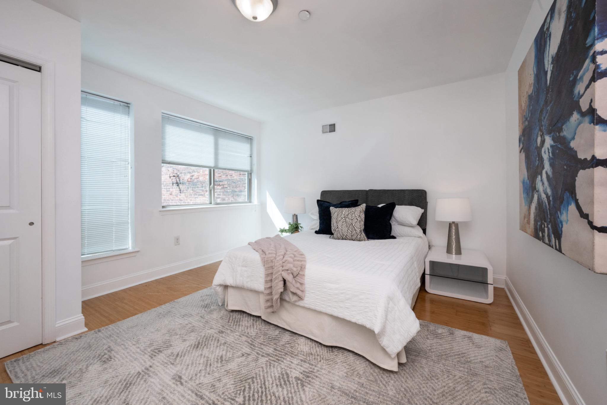 2102 Berges Street, Unit B Philadelphia, PA 19125 - Photo 21 of 29 a bedroom with a bed and window