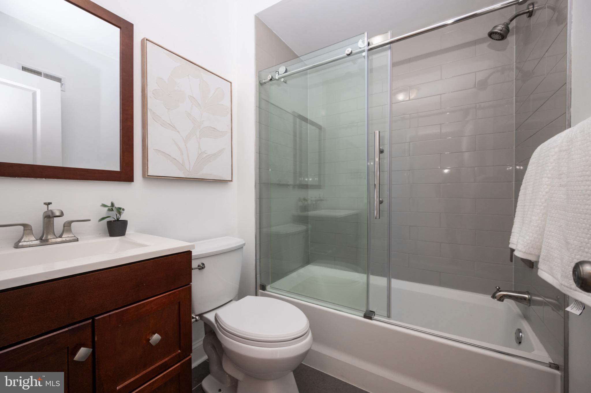 2102 Berges Street, Unit B Philadelphia, PA 19125 - Photo 24 of 29 a bathroom with a sink toilet and shower
