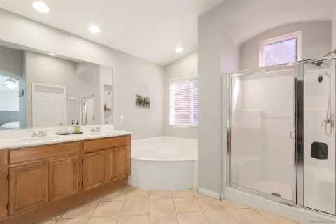 a spacious bathroom with a sink and a mirror