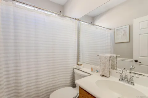 a view of a bedroom with furniture and window