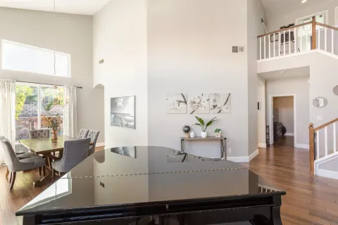 an aerial view of a house with a yard