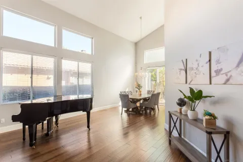 a view of a dining room with furniture and wooden floor