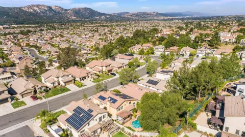 an aerial view of residential houses with outdoor space
