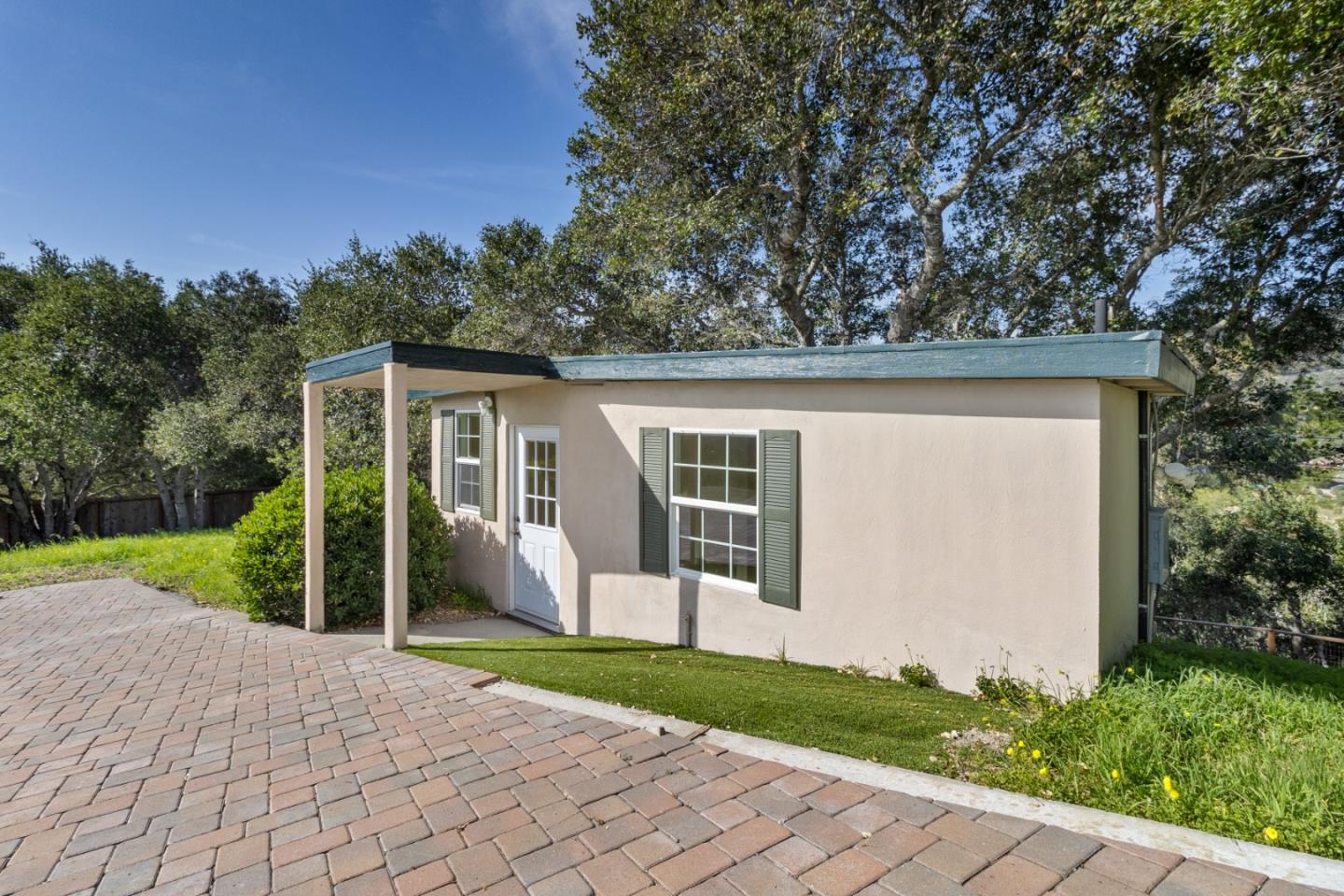 320 El Caminito Road Carmel Valley, CA 93924 - Photo 50 of 62 a view of a house with backyard and a garden