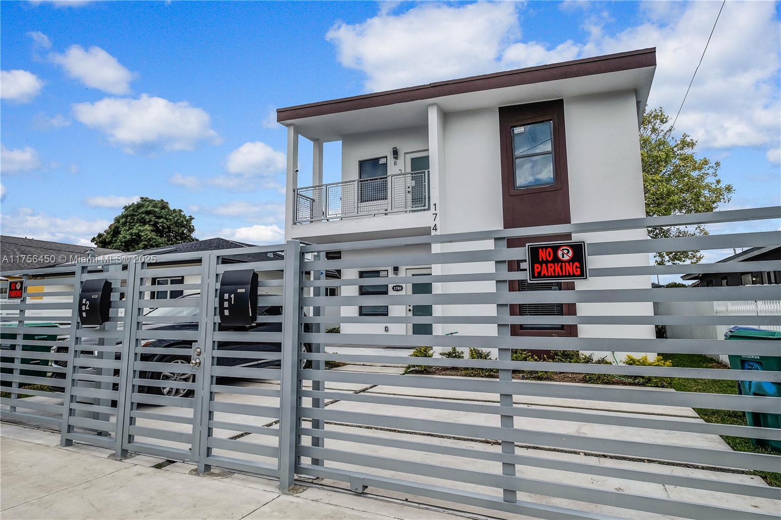 a view of a building with car parked
