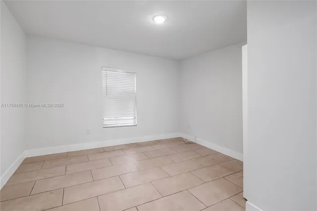 a view of a hallway to rooms