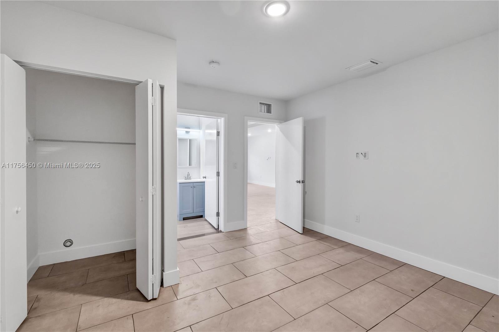 1749 Northwest 64th Street, Unit A Miami, FL 33147 - Photo 14 of 19 a view of a hallway to rooms