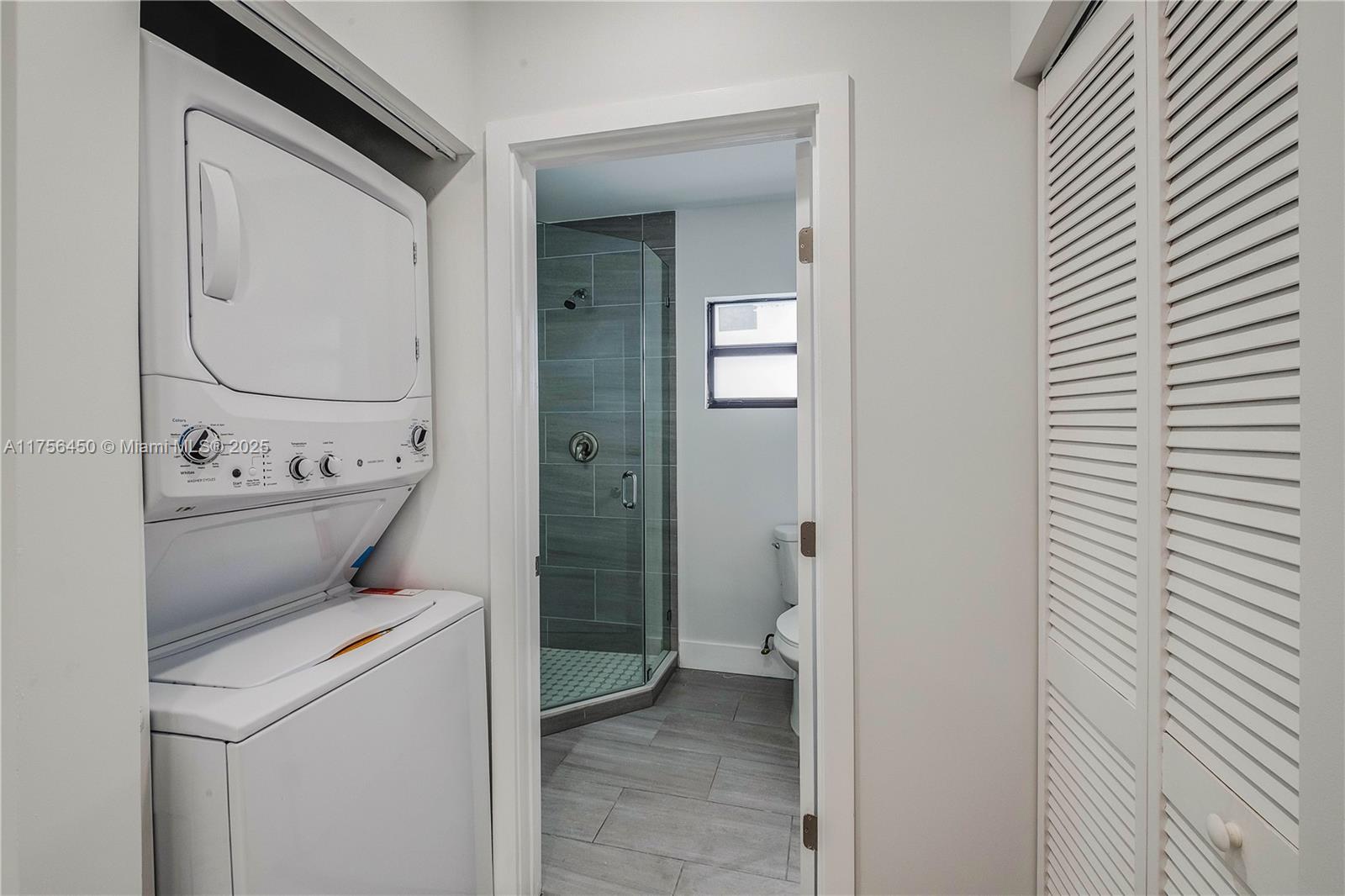 1749 Northwest 64th Street, Unit A Miami, FL 33147 - Photo 7 of 19 a bathroom with a toilet and a sink
