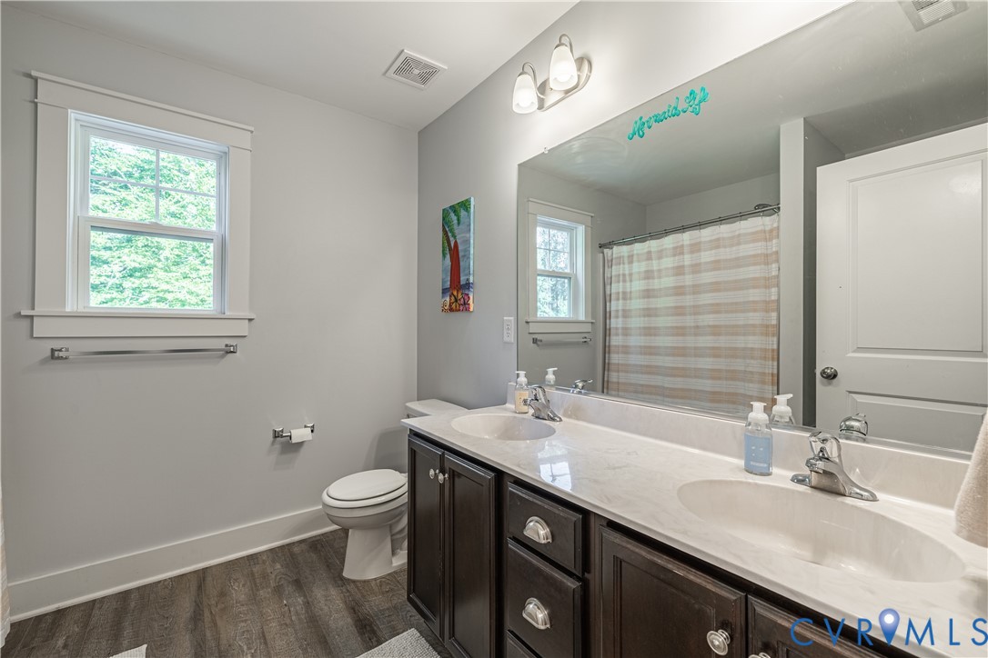 1471 Yakima Road Quinton, VA 23141 - Photo 20 of 39 Full bath featuring double vanity, wood finished f