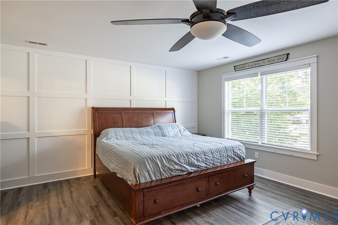 1471 Yakima Road Quinton, VA 23141 - Photo 31 of 39 Bedroom with a decorative wall, dark wood-type flo