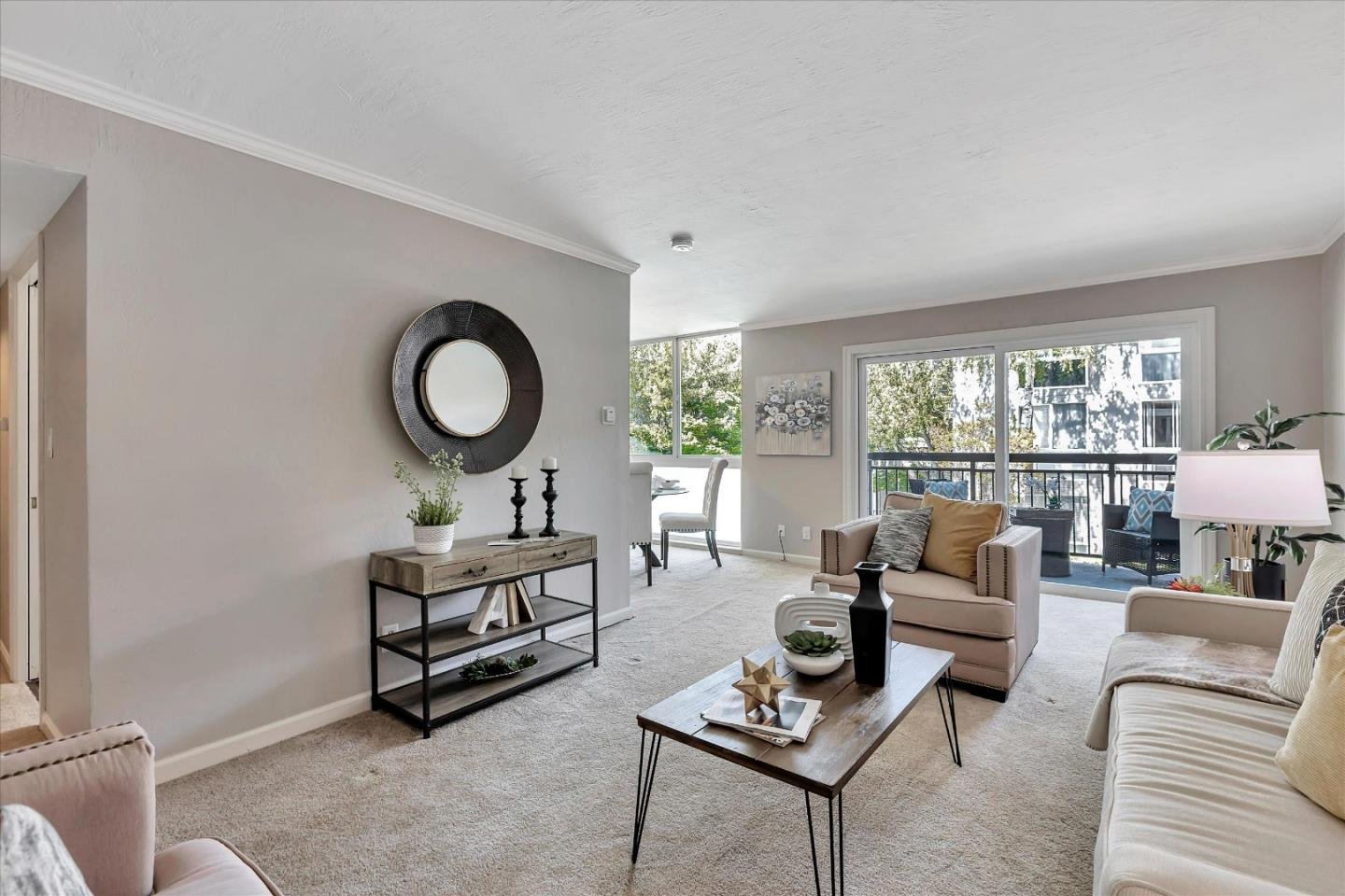 183 Del Medio Avenue, Unit 206 Mountain View, CA 94040 - Photo 1 of 30 a living room with furniture and a large window