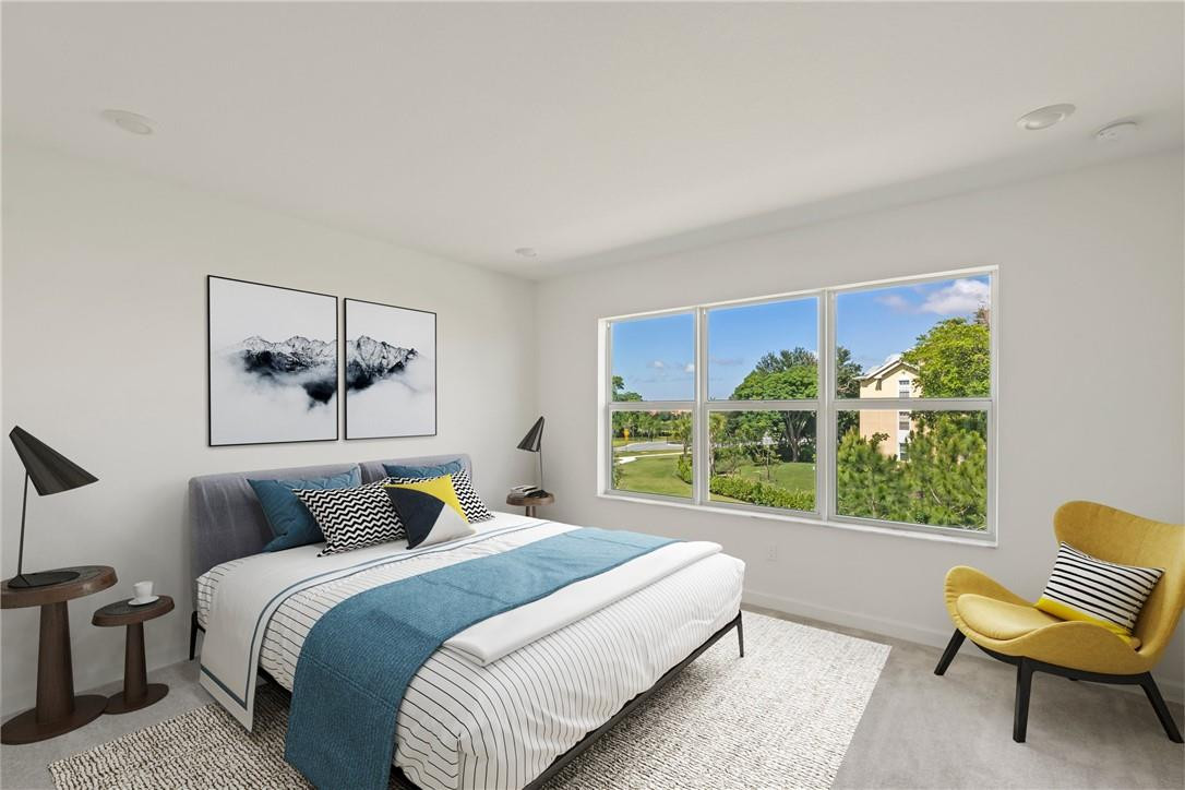 5714 Veranda Way, Unit 2 Boca Raton, FL 33433 - Photo 4 of 24 a bedroom with a large bed and a large window