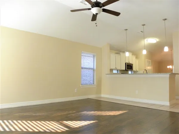 a view of a room with a dishwasher and a window