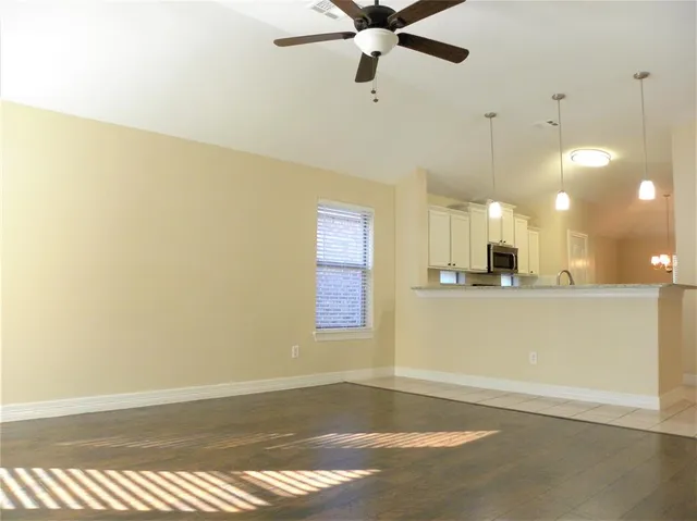 a view of a room with a dishwasher and a window
