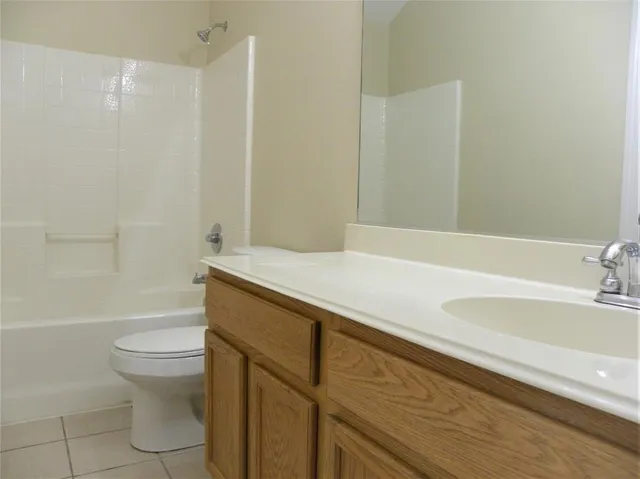 a bathroom with a sink a toilet and a bathtub