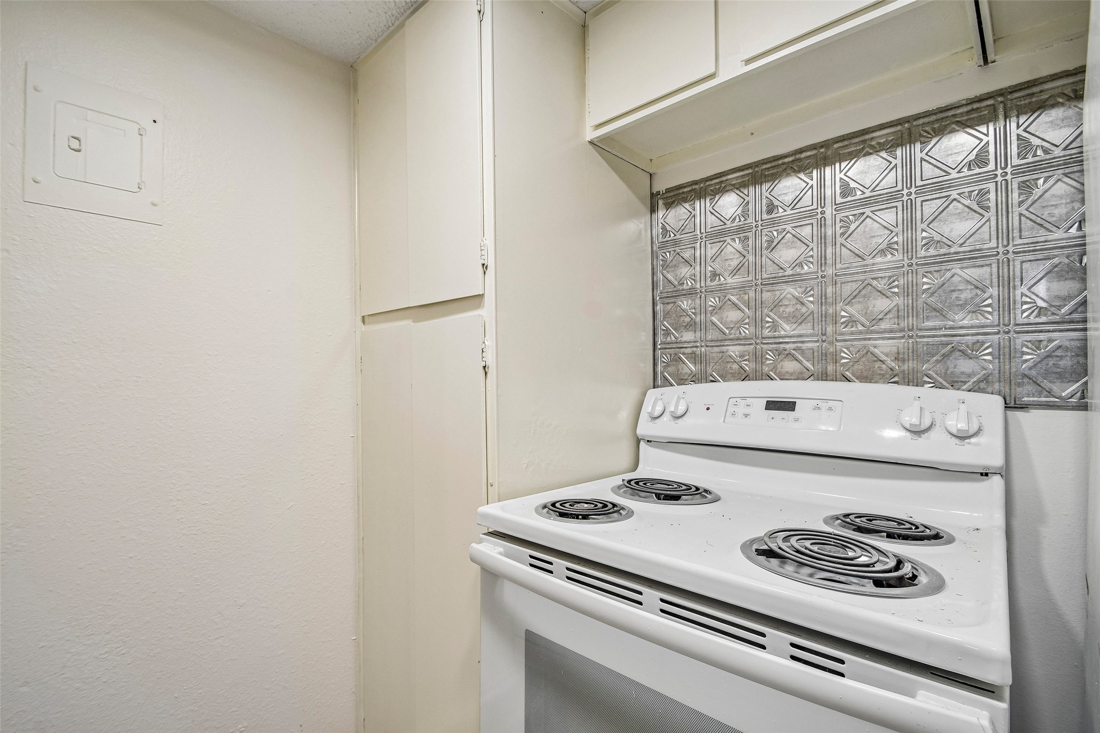 2413 Leon Street, Unit 104 Austin, TX 78705 - Photo 13 of 26 a stove top oven sitting inside of a kitchen