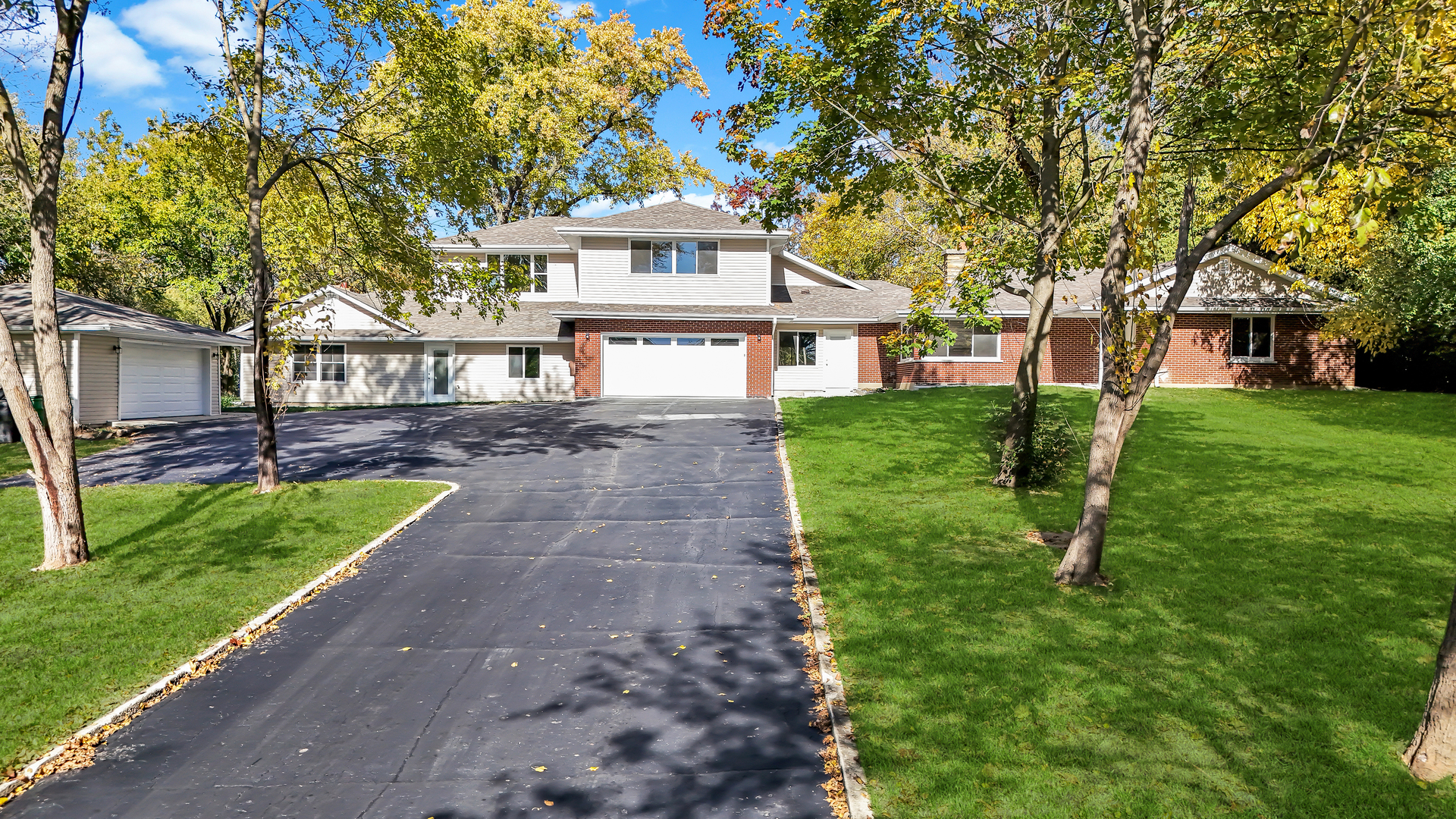 28W360 Roosevelt Road Winfield, IL 60190 - Photo 1 of 50 a front view of a house with a yard