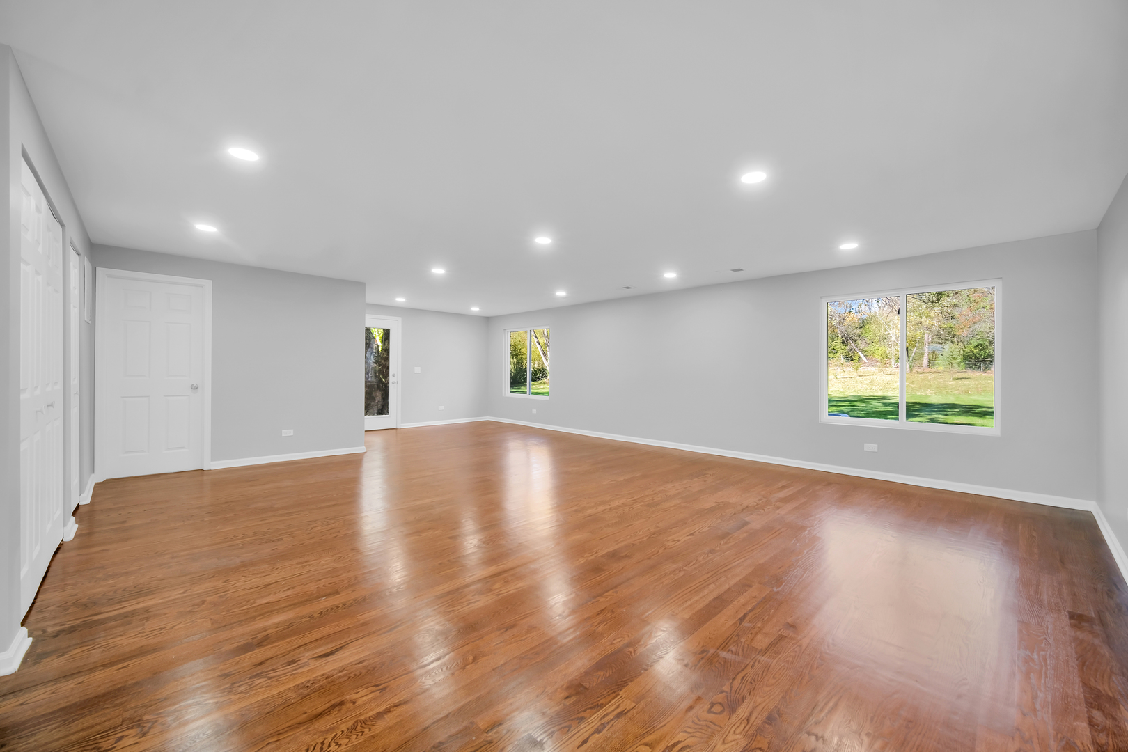 28W360 Roosevelt Road Winfield, IL 60190 - Photo 16 of 50 a view of an empty room with wooden floor and a window