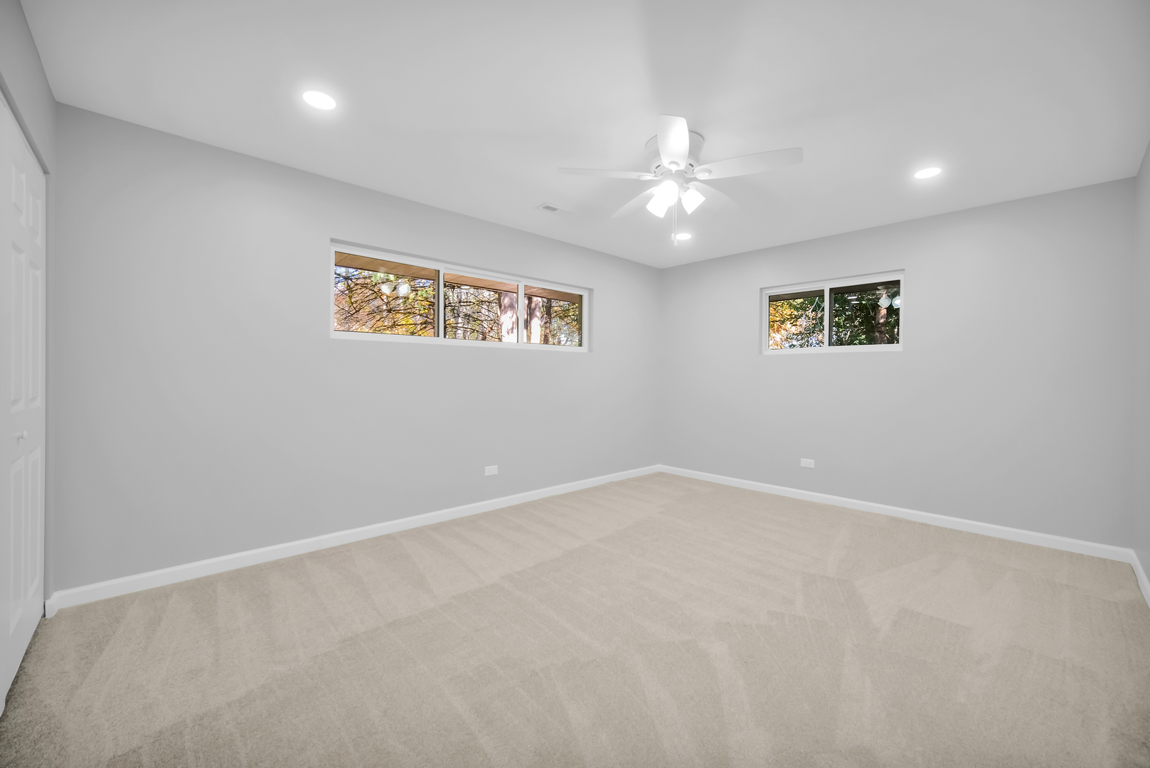 28W360 Roosevelt Road Winfield, IL 60190 - Photo 22 of 50 an empty room with a ceiling fan and window