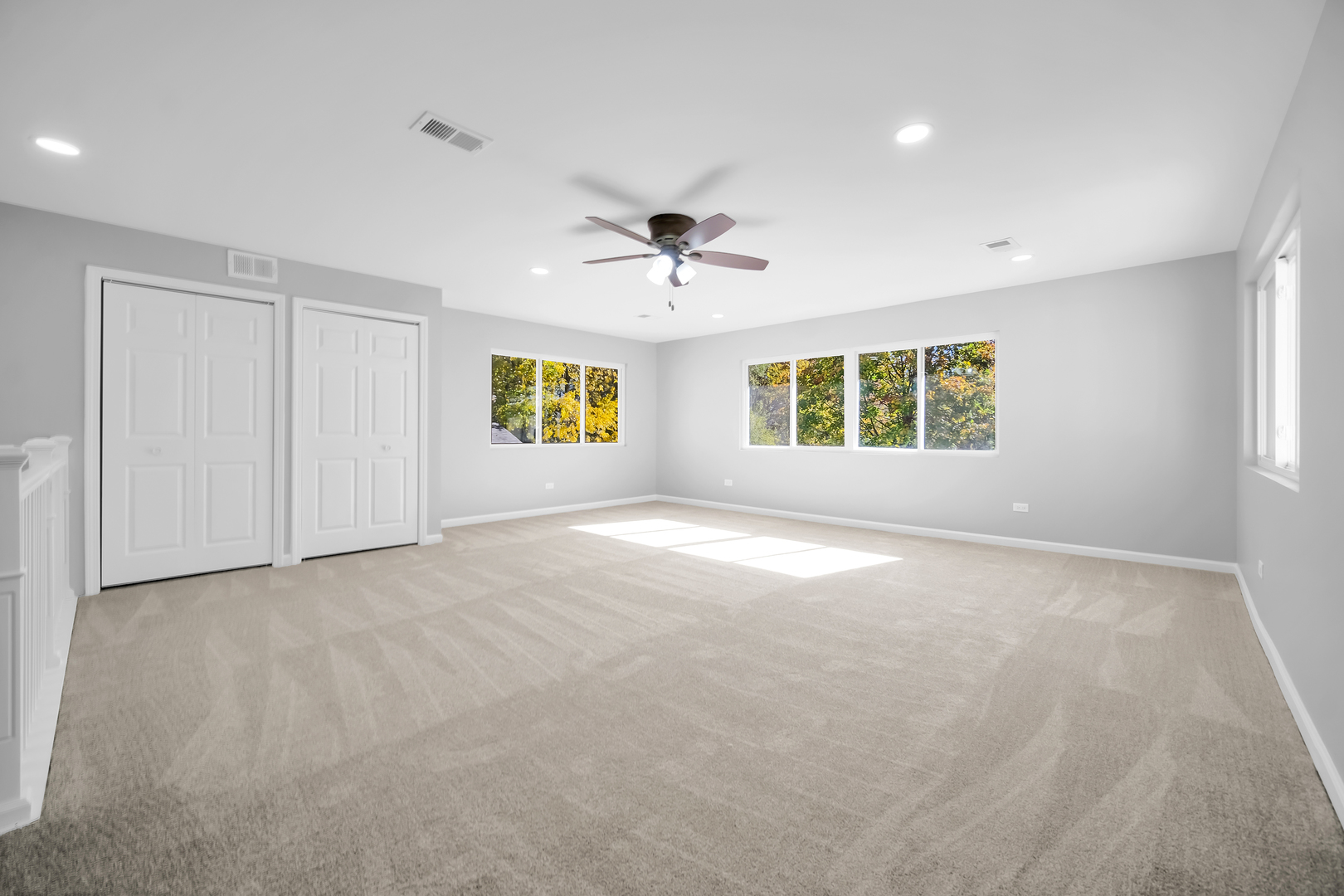 28W360 Roosevelt Road Winfield, IL 60190 - Photo 25 of 50 an empty room with windows and ceiling fan