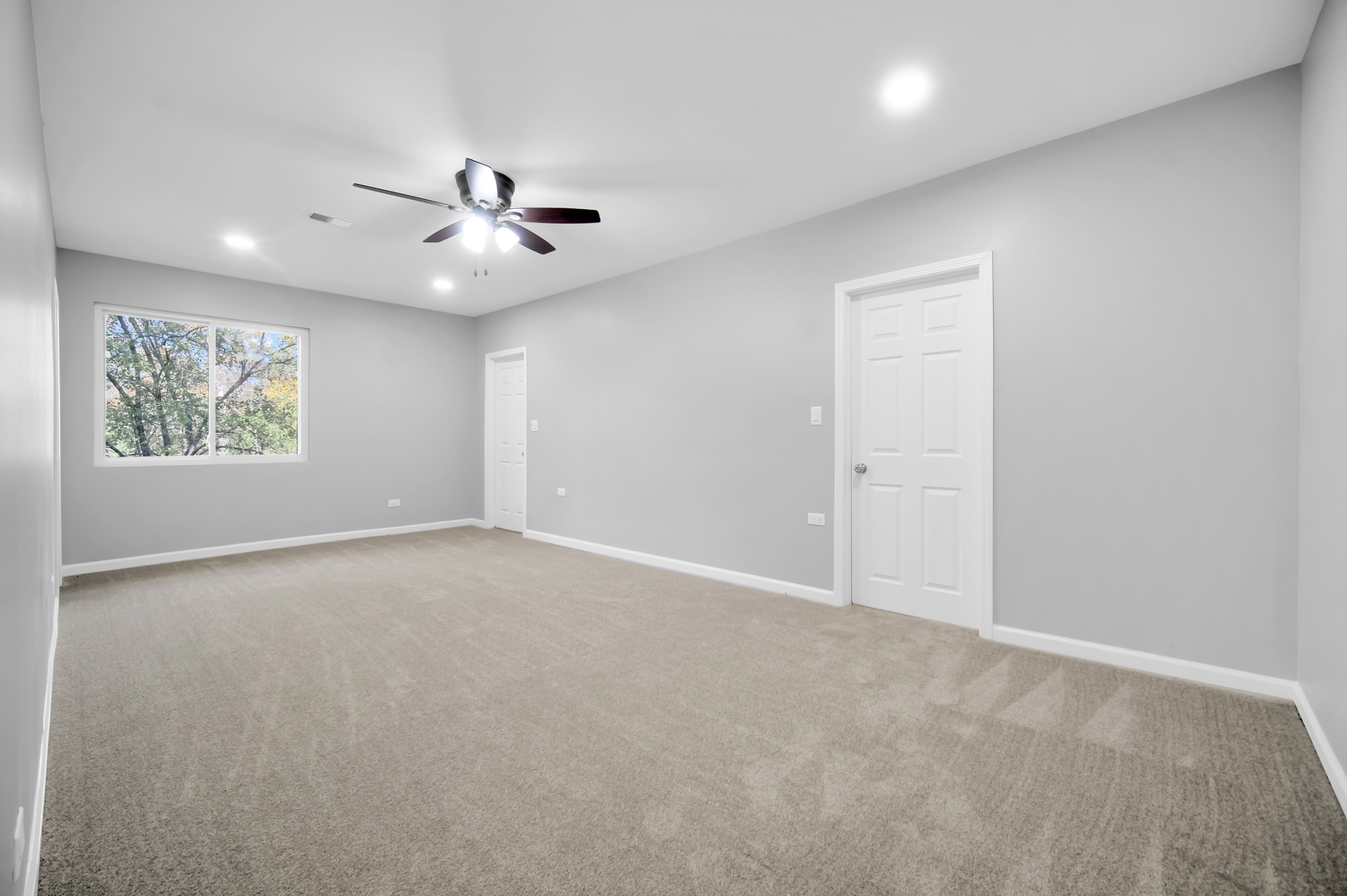 28W360 Roosevelt Road Winfield, IL 60190 - Photo 26 of 50 an empty room with windows and fan